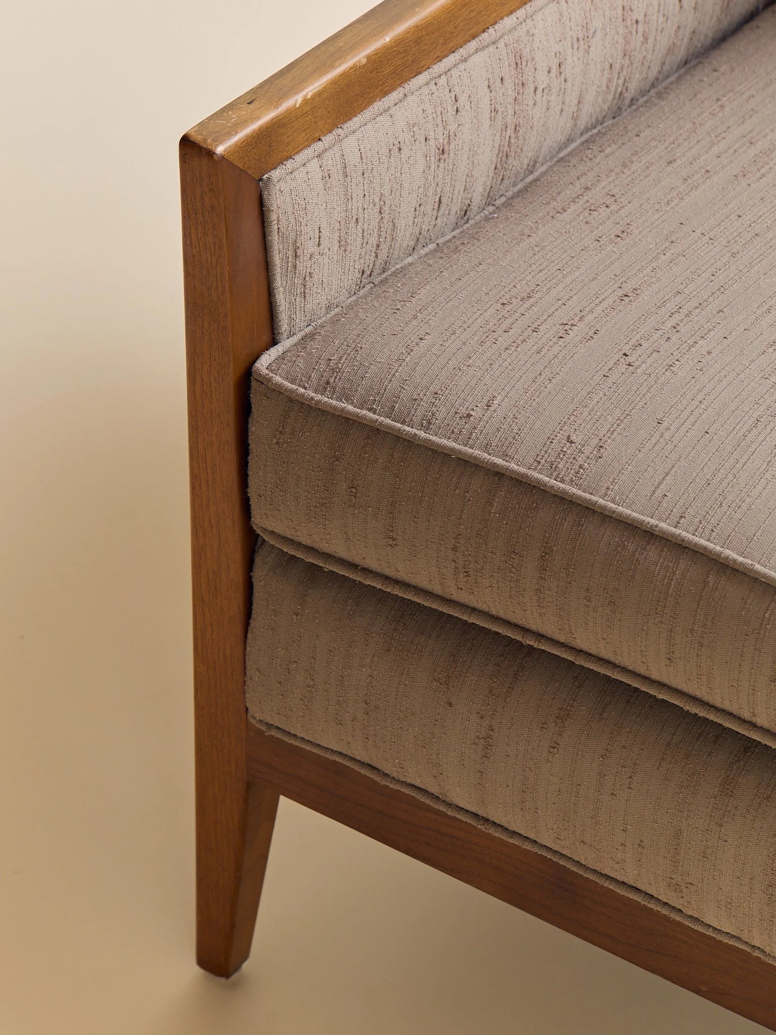 The Vintage Mid Century Walnut Lounge Chair in Textured Beige UpholsterySeatingMiscellanea, etc.