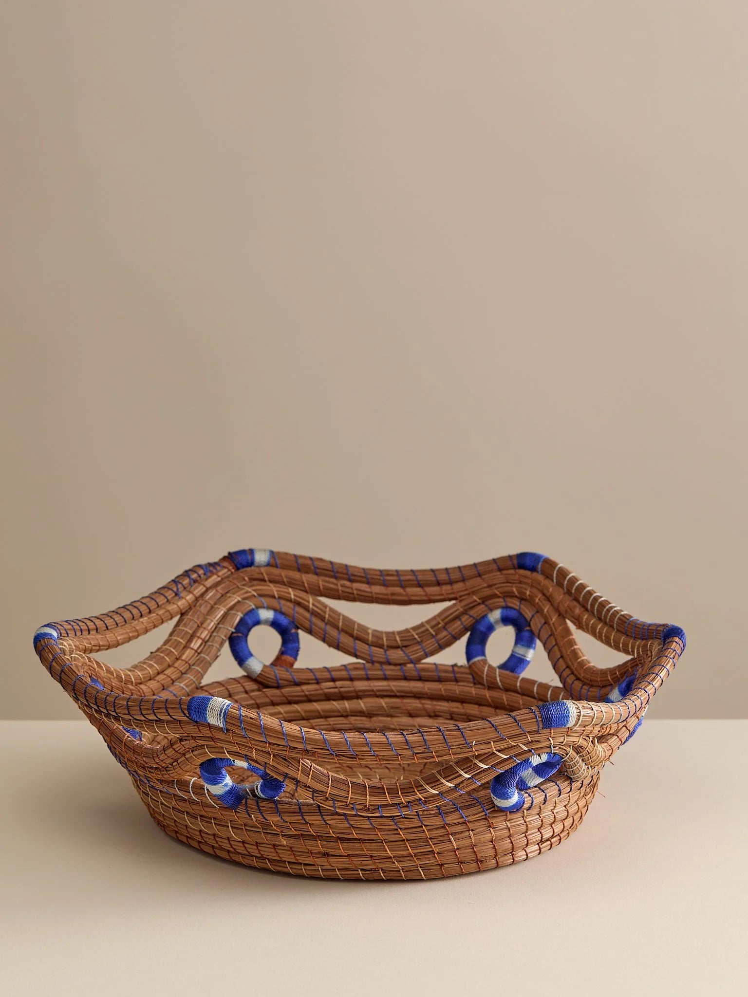 The Vintage Handwoven Basket with Blue and White DetailTrays and BowlsMiscellanea, etc.