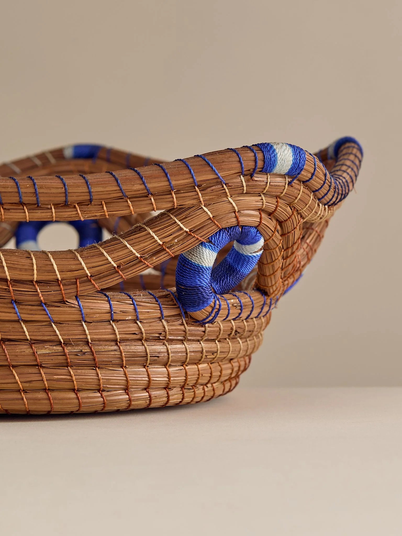 The Vintage Handwoven Basket with Blue and White DetailTrays and BowlsMiscellanea, etc.