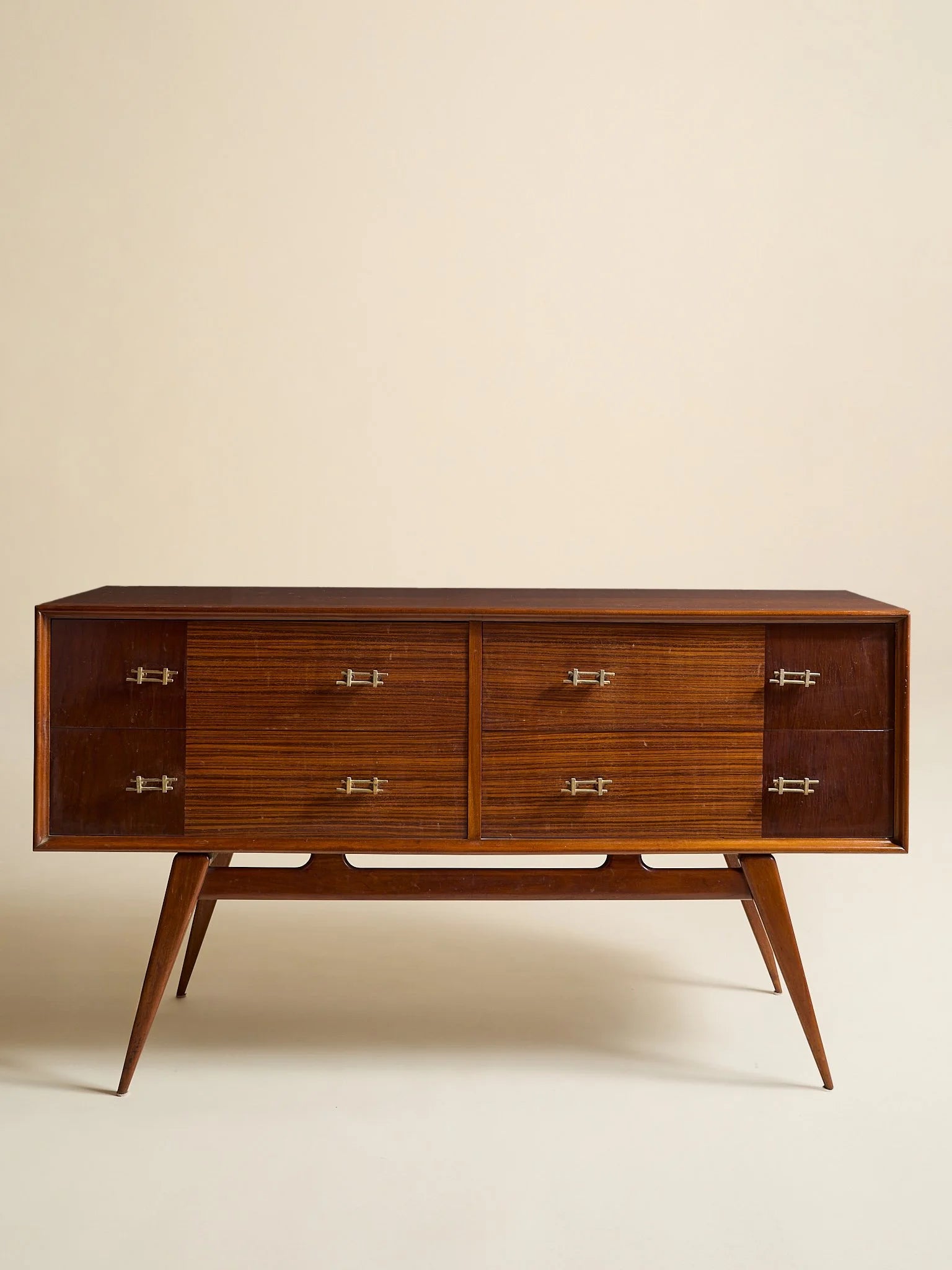 The Vintage 1950s Mahogany And Rosewood Dresser with Brass HardwareChests and DressersMiscellanea, etc.