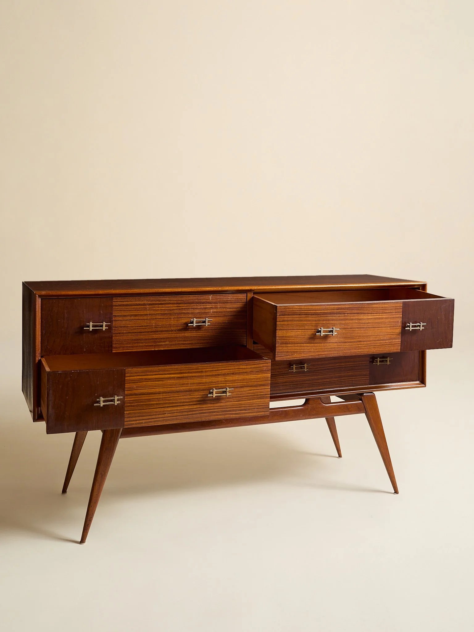 The Vintage 1950s Mahogany And Rosewood Dresser with Brass HardwareChests and DressersMiscellanea, etc.