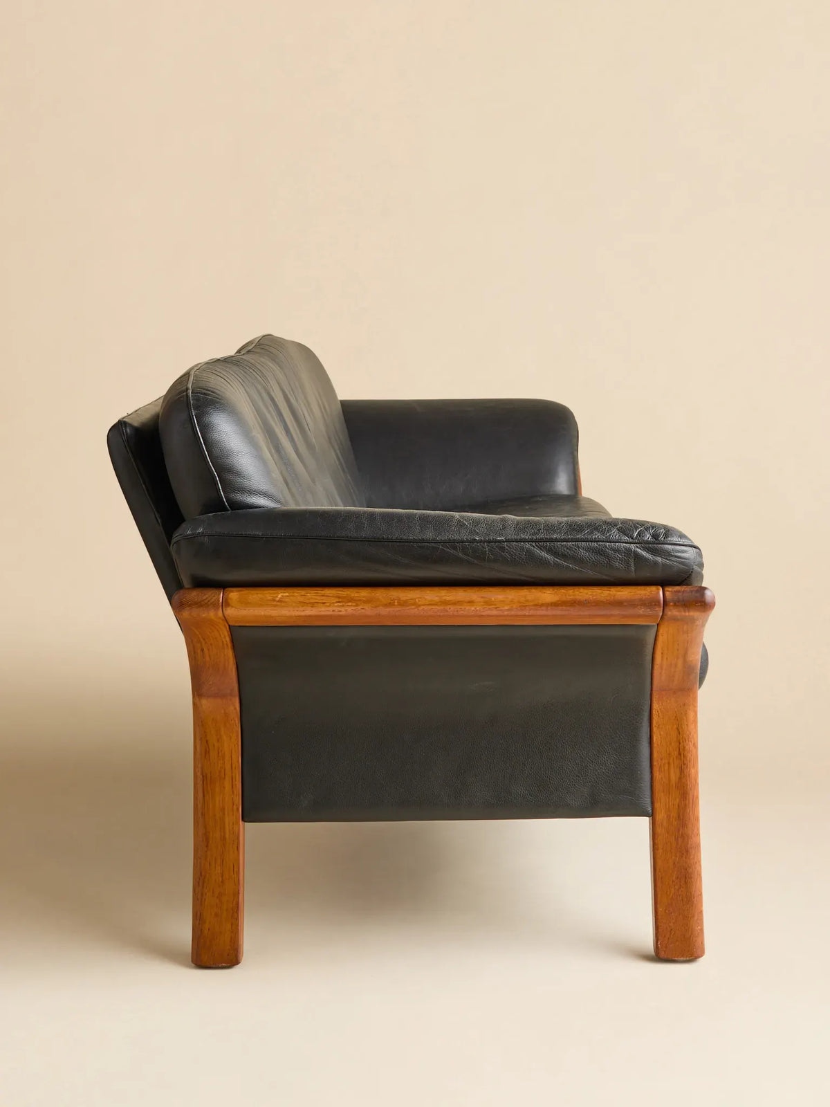 The Vintage Danish Teak & Leather SofaSeatingMiscellanea, etc.